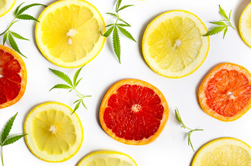 Fototapeta na wymiar Marijuana plant with lemon and grapefruit isolated