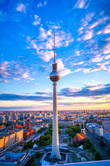 A view of the television tower (Fernsehturm) over the city of Berlin, Germany at sunset. © Jbyard