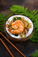 Traditional Asian food. Stir fry with rice, seafood and vegetables in coconut