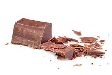 Broken chocolate candy, white background, top view