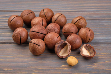 macadamia nuts isolated on wooden background