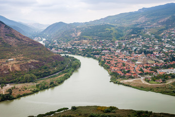 View of the historical center of Mtskheta and the confluence of the Aragvi and Mtkvari rivers in surroundings of Tbilisi, Georgia.