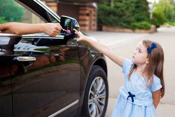 Stranger in the car offers candy to the child. Kids in danger. Children safety protection...