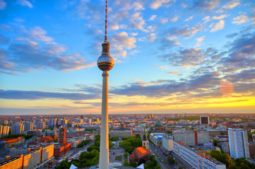 A view of the television tower (Fernsehturm) over the city of Berlin, Germany at sunset.