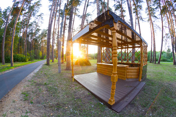 Fototapeta na wymiar Wooden pavilion in forest