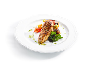 Macro Shot of Grilled Chicken Fillet with Side Dish of Baked Vegetables