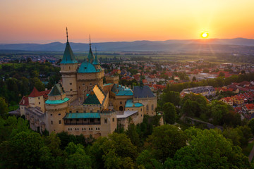 Obraz premium Aerial view of Bojnice medieval castle, UNESCO heritage in Slovakia at sunrise