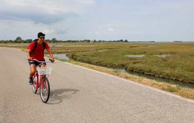 Fototapeta premium young boy with red bike