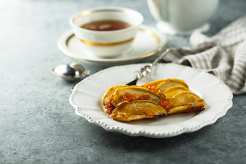 Homemade apple pie with apricot glaze