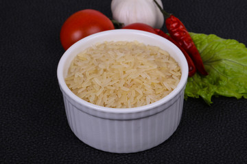 Raw uncooked rice in the bowl