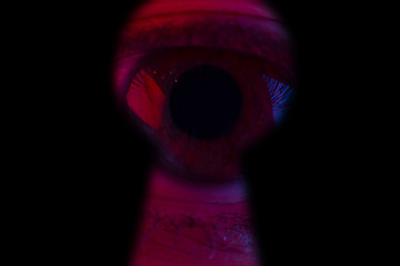Human eye Looking through a keyhole.
