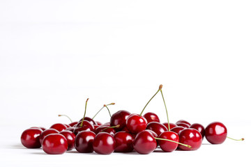 Obraz na płótnie Canvas Sweet cherries on white background