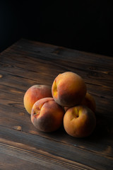 peaches on wooden table
