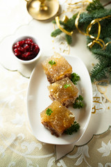 Festive meat jelly with sauces on white plate