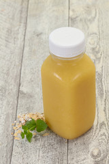 Dietary vegetarian oats milk over wooden