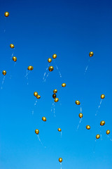Celebration day colorful golden balloons in the sky