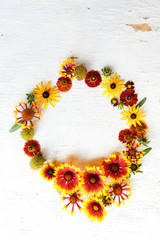 Flower composition on a wooden white background