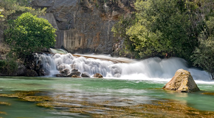 Naklejka premium Small waterfall on the Mijares river in long exposure