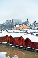Old historic Porvoo, Finland with wooden houses and medieval stone and brick Porvoo Cathedral under white snow in winter - 287441992