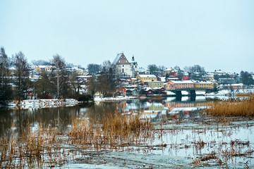 Old historic Porvoo, Finland with wooden houses and medieval stone and brick Porvoo Cathedral under white snow in winter - 287442131