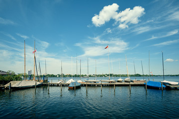 Nice yachts and boats on sunny summer day at the Alster lake in Hamburg, Germany - 287442179