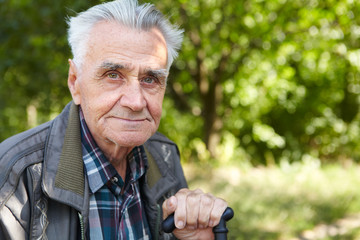 Elderly poor man thinks about life