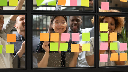 Happy asian female leader and team celebrate corporate goal achievement