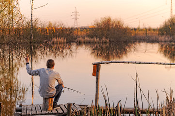 young fisherman on the lake