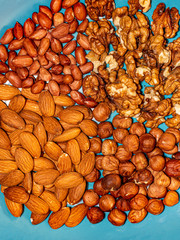 Mix of nuts on a blue background.