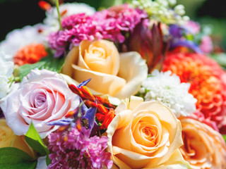 Wedding bouquet. Bride's traditional symbolic accessory.Colorful floral composition with roses.
