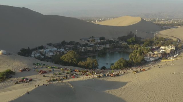 Aerial view of Huacachina Oasis. A famous place where locals and tourist go to view the sunset.