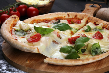 vegetarian italian Pizza with tomatoes, mozzarella cheese  and basil. Delicious italian pizza