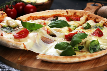 vegetarian italian Pizza with tomatoes, mozzarella cheese  and basil. Delicious italian pizza