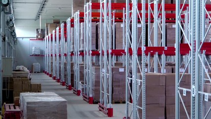 Modern, spacious, large warehouse storage and consolidation of goods. Racks are filled with boxes