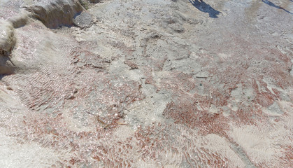 Snow-white salt deposits on the stone slopes created natural patterns.