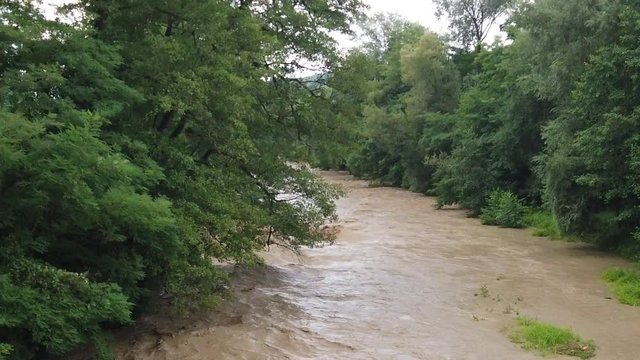 Involued muddy waters after heavy rain.Torrent of muddy waters after the rain.