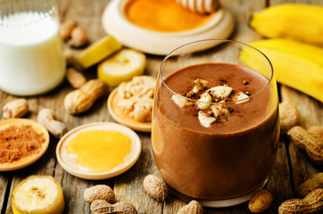 peanut butter smoothie with milk, chocolate, apples, banana and oats