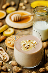 peanut butter smoothie with milk, chocolate, apples, banana and oats