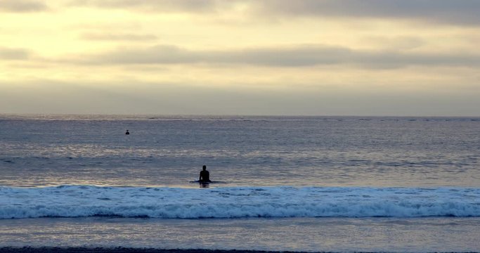 Surfer Paddling Out at Sunset, San Diego