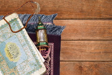 Ornamental Arabic lantern oud perfume with black rosary, prayer mat Ramadan Kareem Greeting Card. Ramadan Mubarak. Translated: Happy & Holy Ramadan. Month of fasting for Muslims.