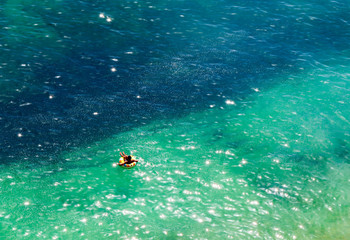 man relaxing on a float on the atlactic ocean coast