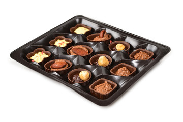 Chocolate candy collection in plastic box.