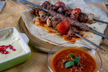 Arabic Barbecue food with fresh tomato sauce and garlic 