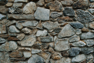 Old stone work wall with field stone rocks