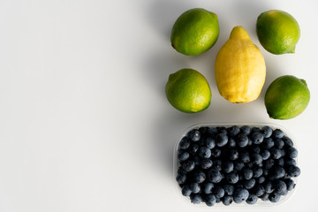 Top view of lemon with imes and blueberries