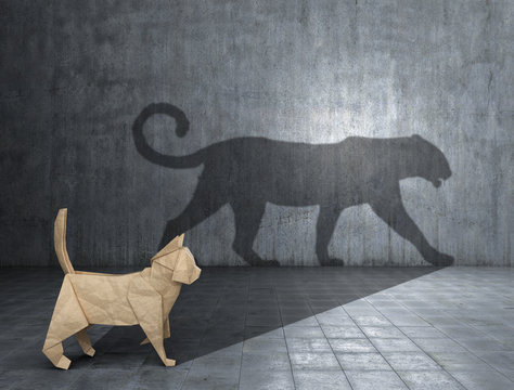 Concept of hidden potential. A paper figure of a cat that fills the shadow of a jaguar. 3D illustration