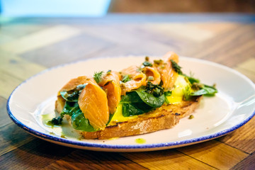 Bruschetta with salmon, spinach and poached egg