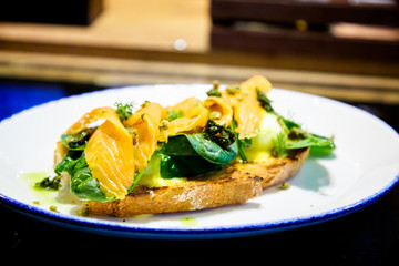 Bruschetta with salmon, spinach and poached egg