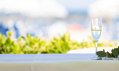 White wine glass, abstract defocused background