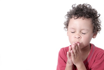 boy praying to God stock image with hands held together with closed eyes with white background stock image stock photo